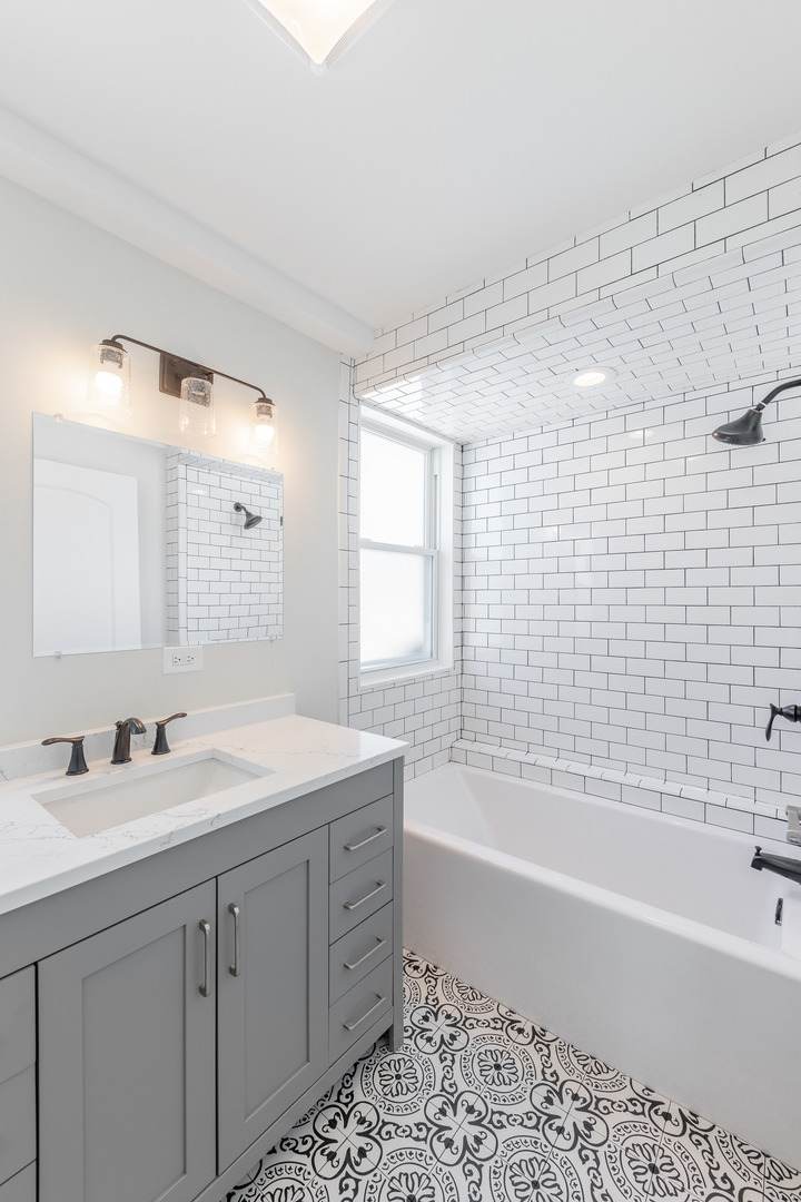 9160 South Hamilton Avenue Chicago, IL 60643 - Photo 26 of 53 a bathroom with a bathtub sink vanity granite and shower
