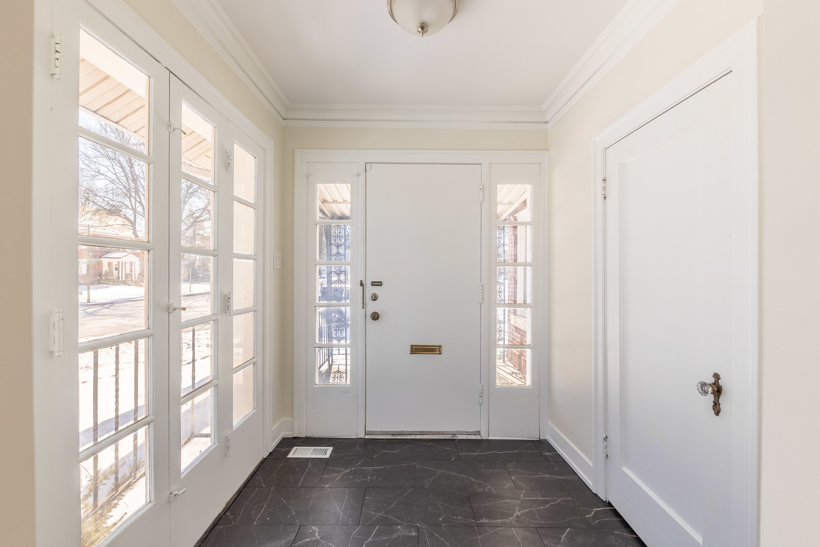 9160 South Hamilton Avenue Chicago, IL 60643 - Photo 3 of 53 a view of an entryway with wooden floor and windows