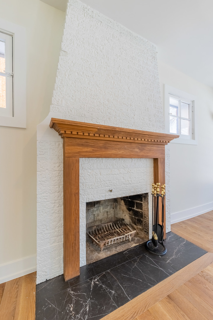 9160 South Hamilton Avenue Chicago, IL 60643 - Photo 6 of 53 a living room with a fireplace