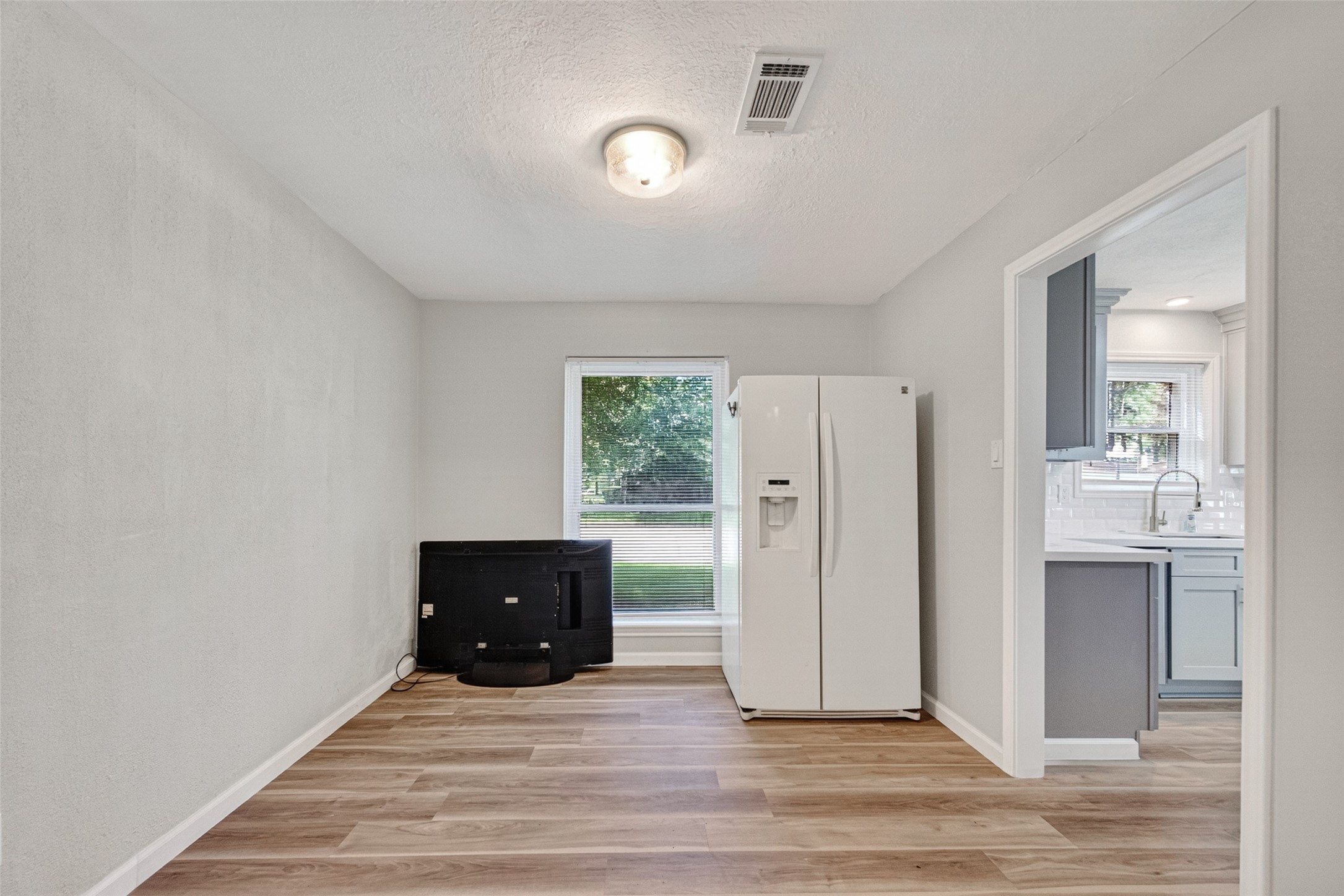 25503 Foxbriar Lane Spring, TX 77373 - Photo 11 of 45 a view of an empty room and a kitchen