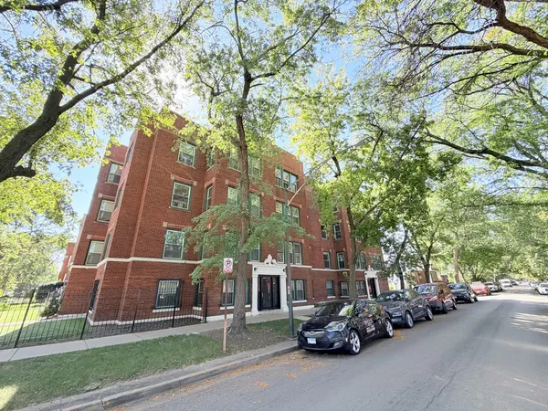 a view of a parked cars in front of a building