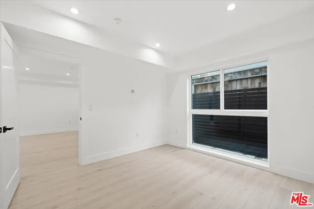 wooden floor in an empty room with a fireplace