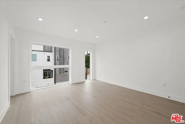 a view of a kitchen with a refrigerator and a stove