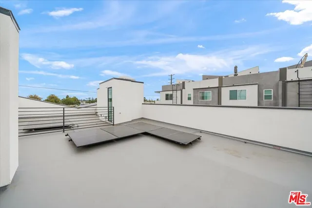 a view of a living room and workspace