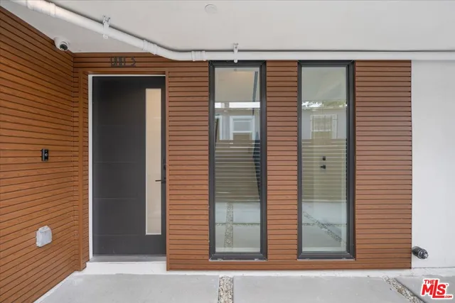 a view of a door and a window