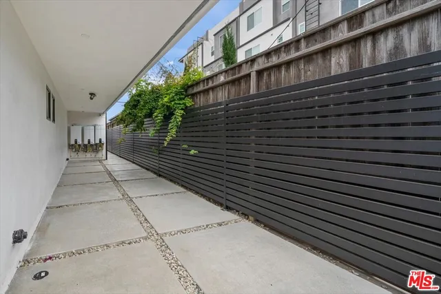 a view of a pathway along the building