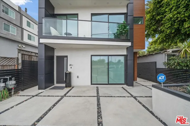 a view of a house with a door and a window