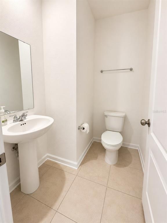 339 Redbud Road Palm Coast, FL 32137 - Photo 10 of 22 a bathroom with a sink a toilet and shower