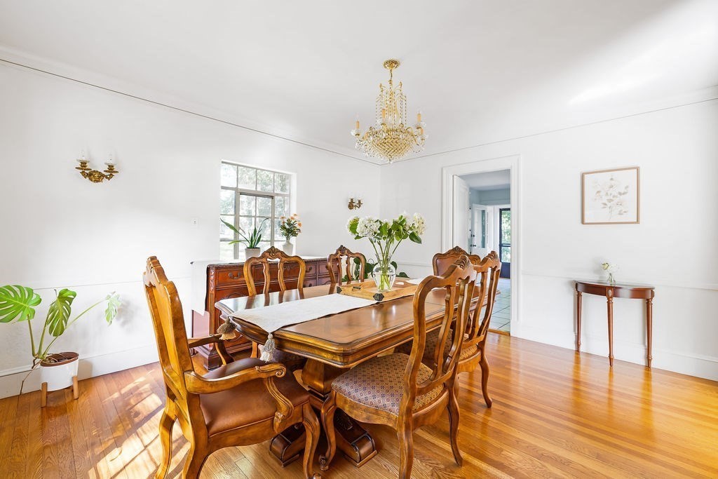 1069 West Roxbury Parkway Brookline, MA 02467 - Photo 12 of 27 a view of a dining room with furniture and wooden floor