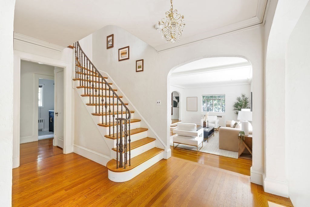 1069 West Roxbury Parkway Brookline, MA 02467 - Photo 13 of 27 a view of a livingroom with furniture staircase and front door