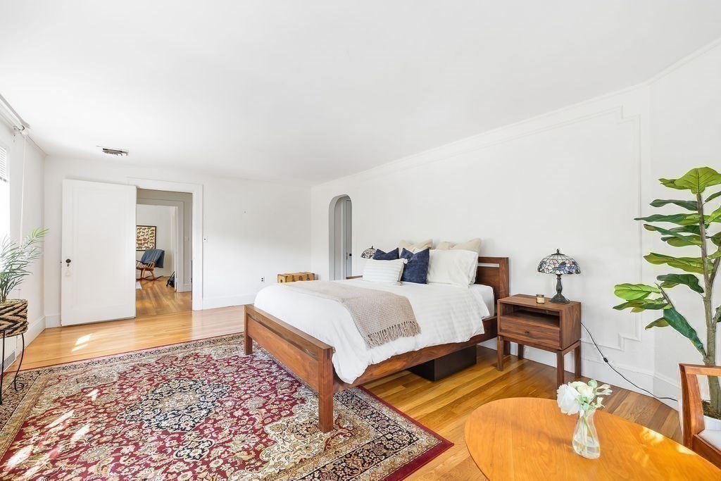 1069 West Roxbury Parkway Brookline, MA 02467 - Photo 15 of 27 a bedroom with a bed and a table