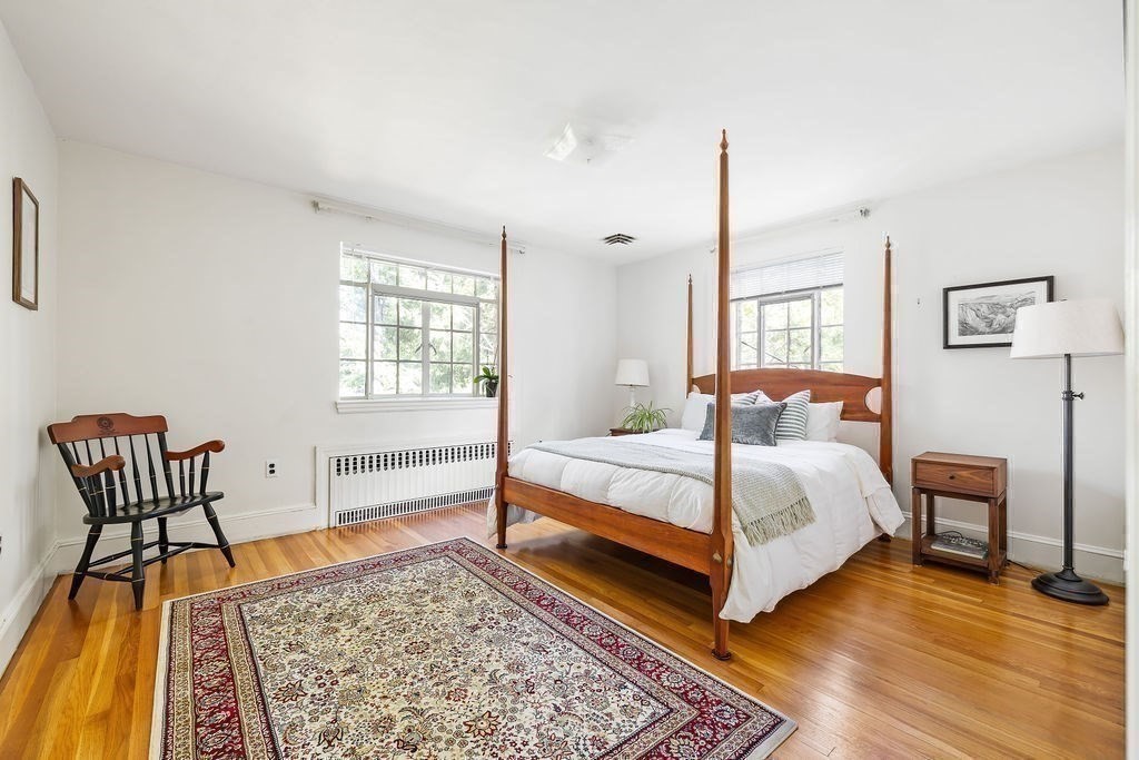 1069 West Roxbury Parkway Brookline, MA 02467 - Photo 18 of 27 a bedroom with a bed and a table