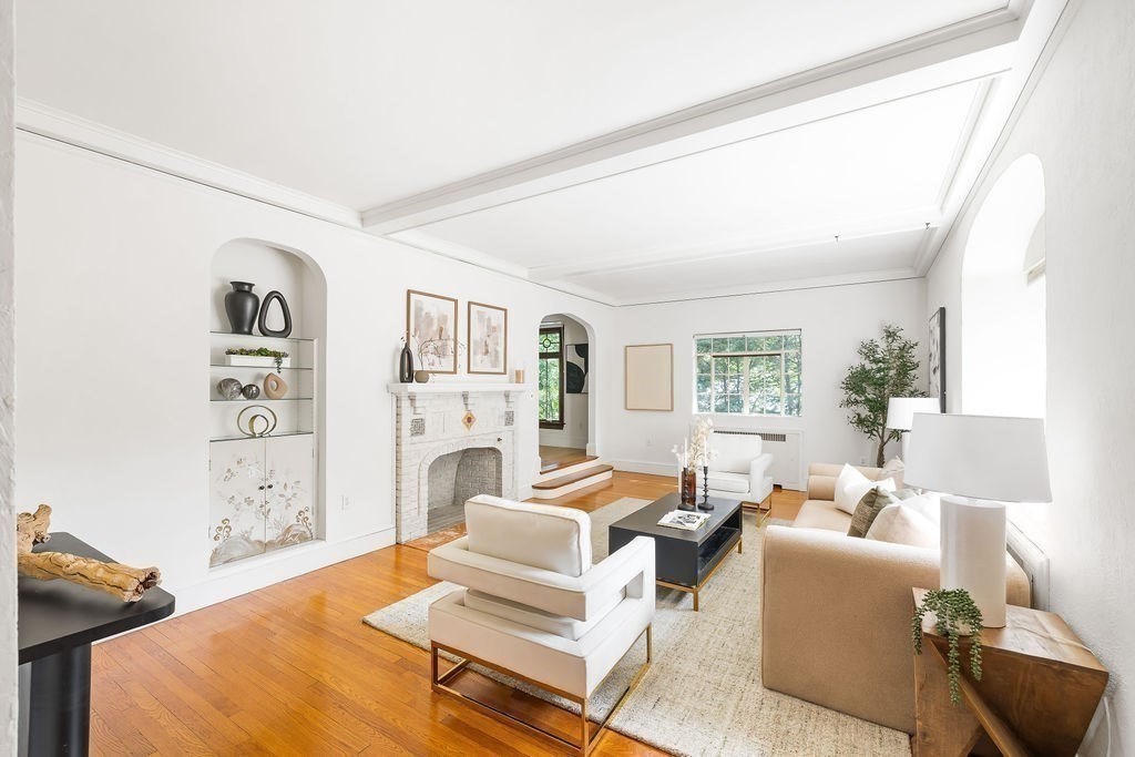 1069 West Roxbury Parkway Brookline, MA 02467 - Photo 3 of 27 a living room with furniture large window and a table