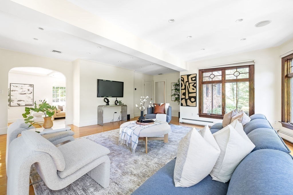 1069 West Roxbury Parkway Brookline, MA 02467 - Photo 6 of 27 a living room with furniture flat screen tv and a large window