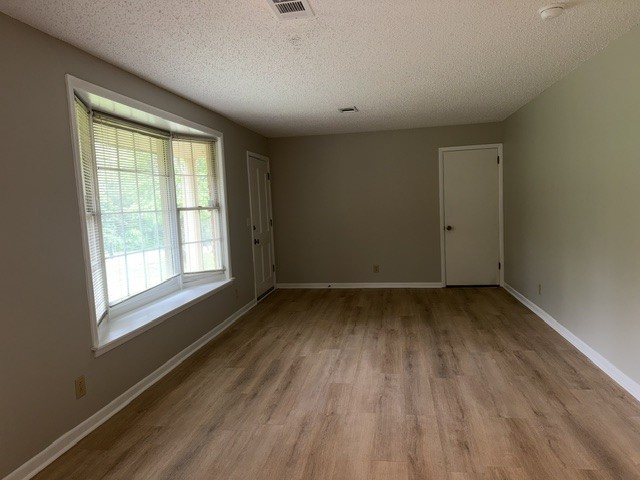 7643 Harper Road Joelton, TN 37080 - Photo 2 of 11 a view of a room with wooden floor and windows