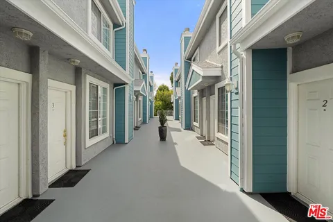 a view of an entryway with a white walls