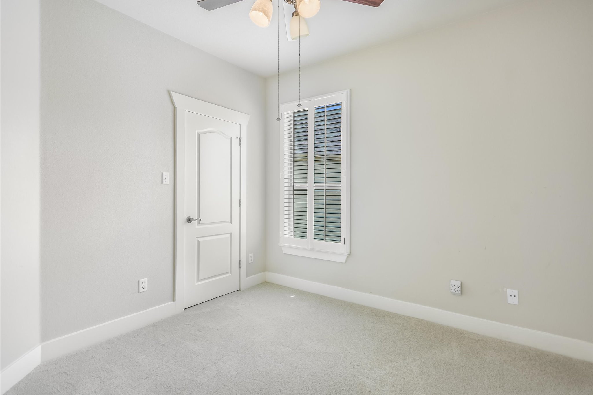 210 Rivulet Lane Austin, TX 78738 - Photo 18 of 20 Spare room with carpet floors and ceiling fan
