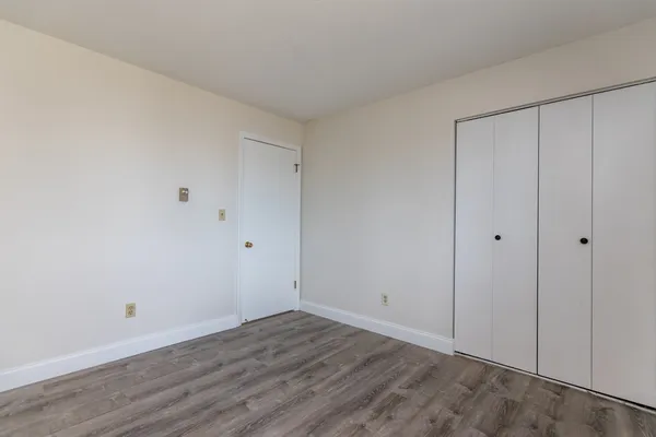 a view of room with hardwood floor