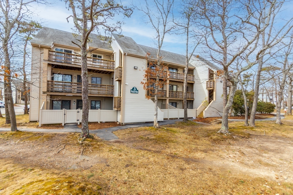 800 Bearses Way, Unit 3NE Hyannis, MA 02601 - Photo 16 of 20 a view of a house with a backyard