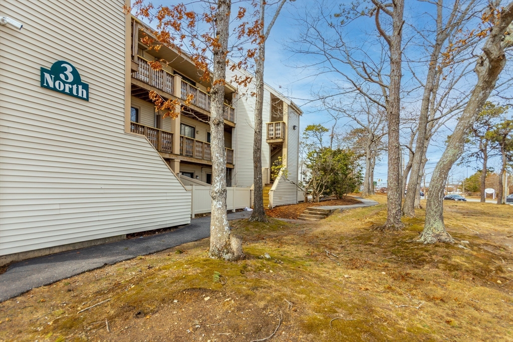 800 Bearses Way, Unit 3NE Hyannis, MA 02601 - Photo 17 of 20 a view of a house with snow on the wall