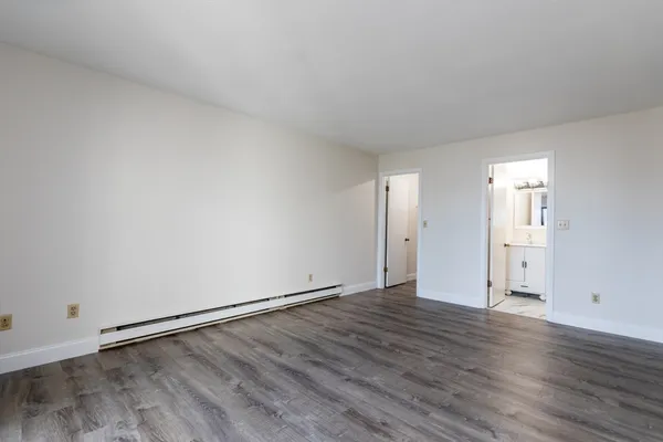 an empty room with wooden floor