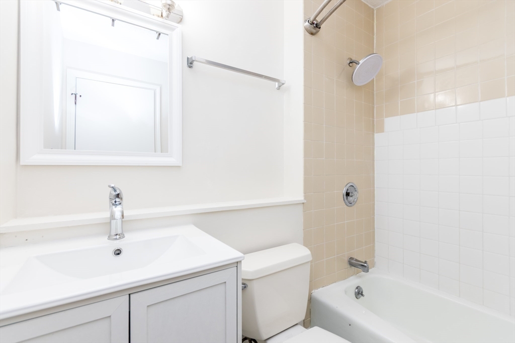 800 Bearses Way, Unit 3NE Hyannis, MA 02601 - Photo 10 of 20 a bathroom with a sink a toilet and a bathtub