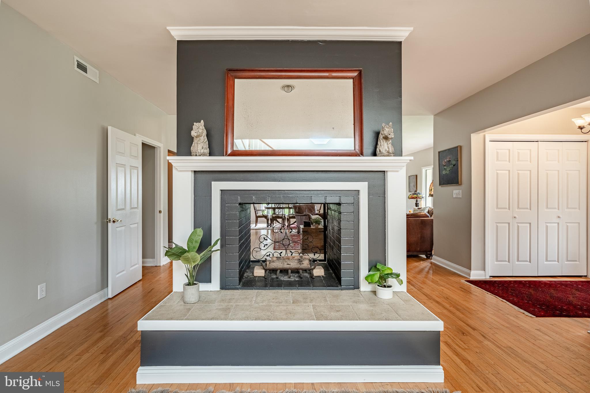 763 Denton Hollow Road West Chester, PA 19382 - Photo 14 of 80 a living room with a fireplace windows and a fireplace