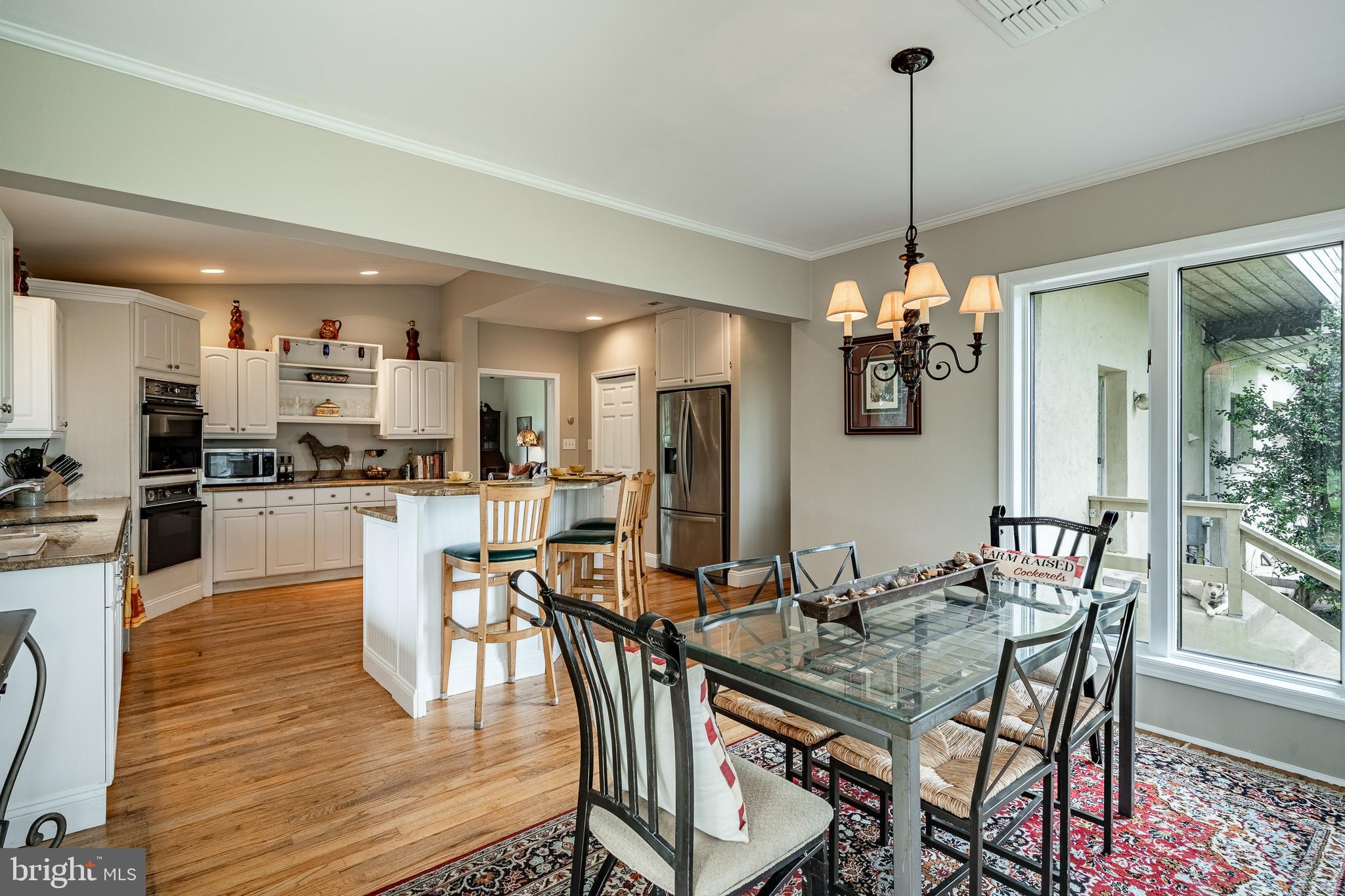 763 Denton Hollow Road West Chester, PA 19382 - Photo 23 of 80 a view of a dining room and livingroom with furniture wooden floor a chandelier