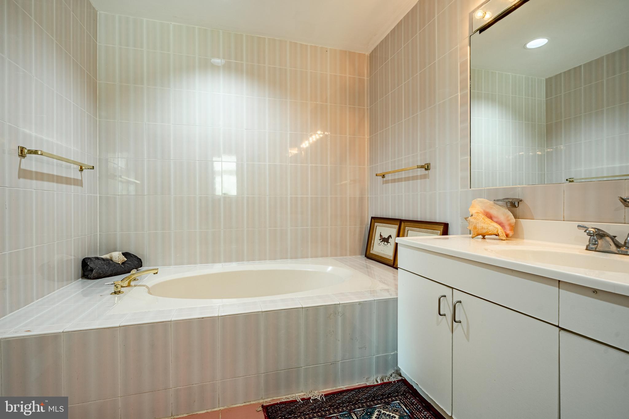 763 Denton Hollow Road West Chester, PA 19382 - Photo 26 of 80 a bathroom with a tub sink and mirror