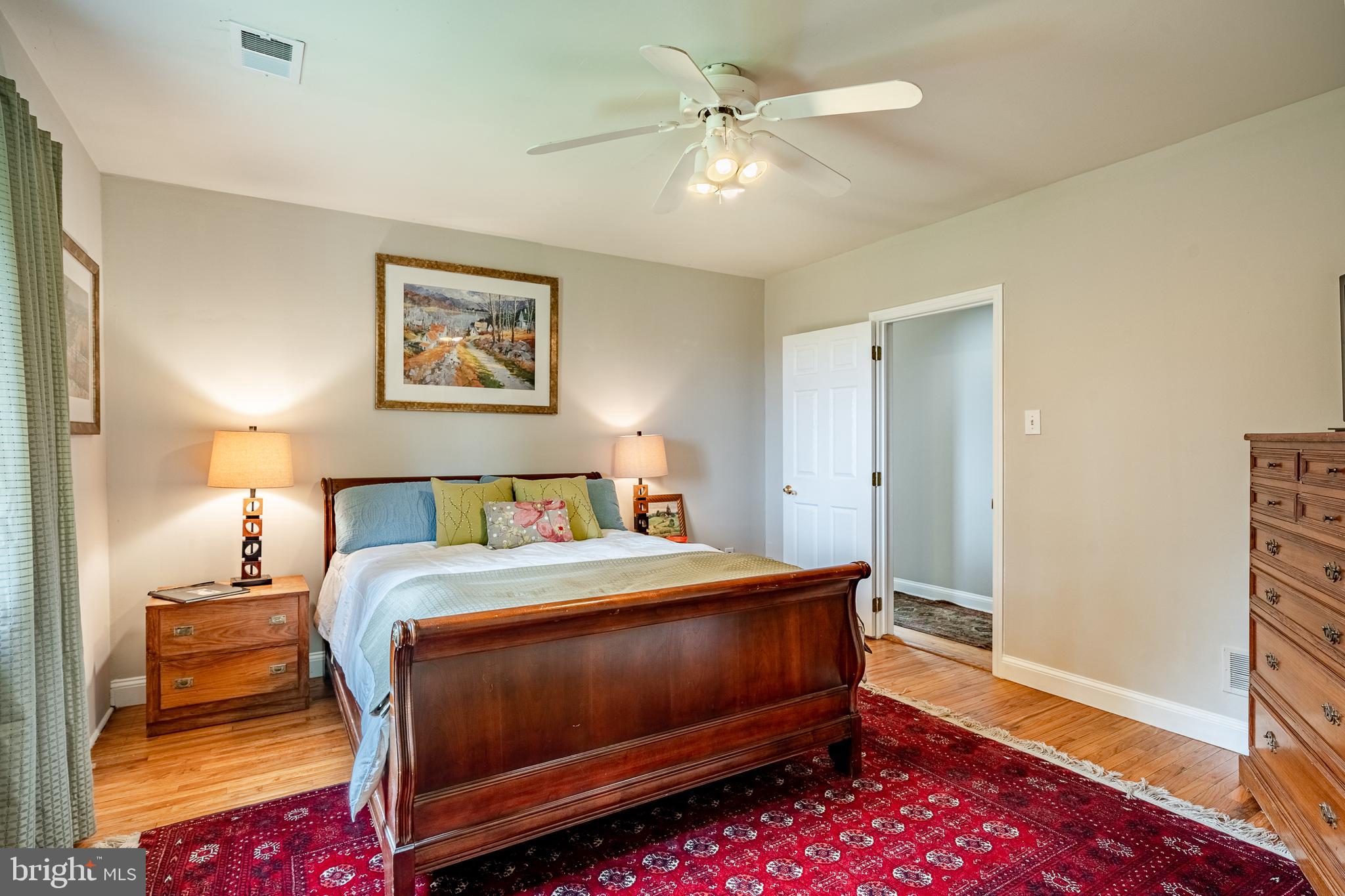 763 Denton Hollow Road West Chester, PA 19382 - Photo 29 of 80 a bedroom with a bed and a chandelier