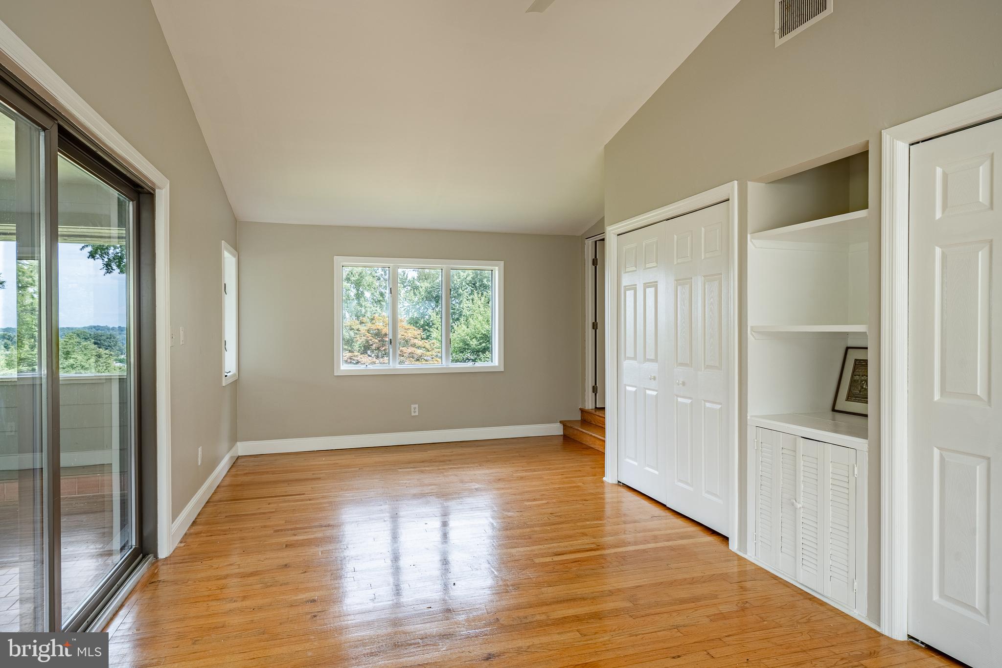 763 Denton Hollow Road West Chester, PA 19382 - Photo 40 of 80 a view of an empty room with wooden floor and a window