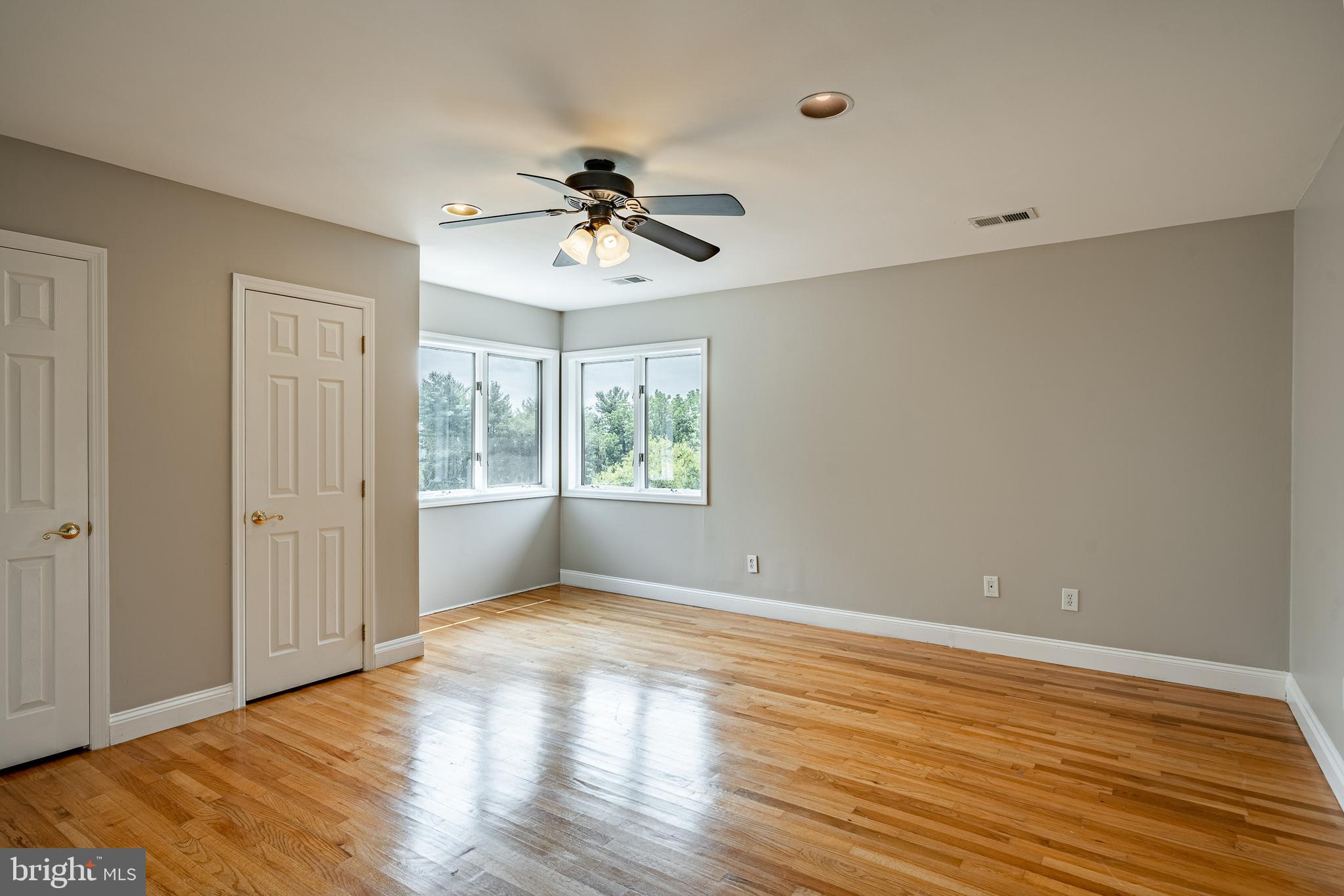 763 Denton Hollow Road West Chester, PA 19382 - Photo 43 of 80 a view of an empty room with wooden floor and a window