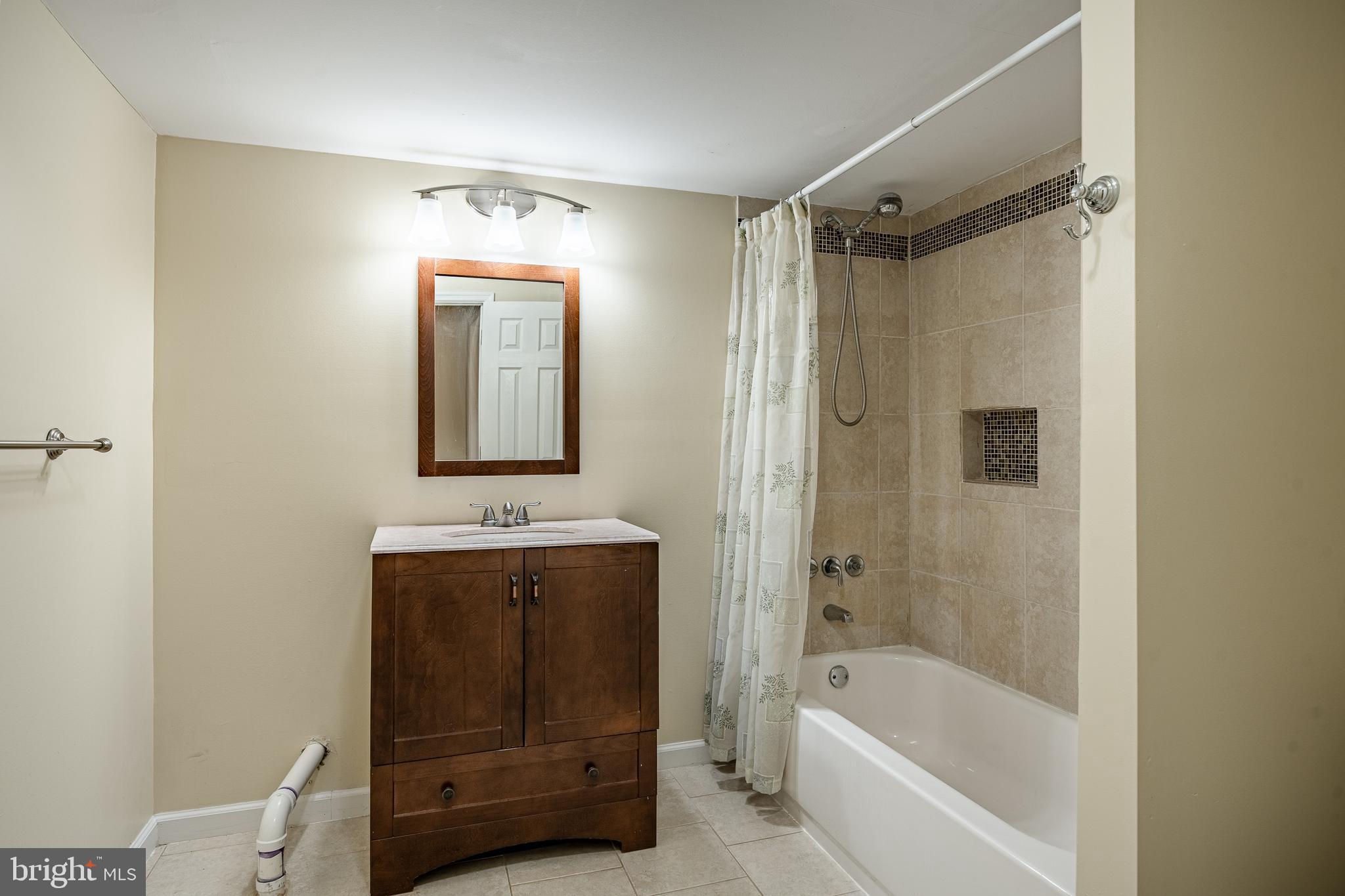763 Denton Hollow Road West Chester, PA 19382 - Photo 50 of 80 a bathroom with a bathtub and a sink