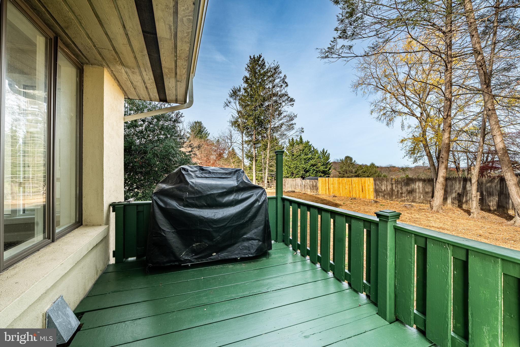 763 Denton Hollow Road West Chester, PA 19382 - Photo 69 of 80 a view of a deck with wooden floor and fence next to a yard