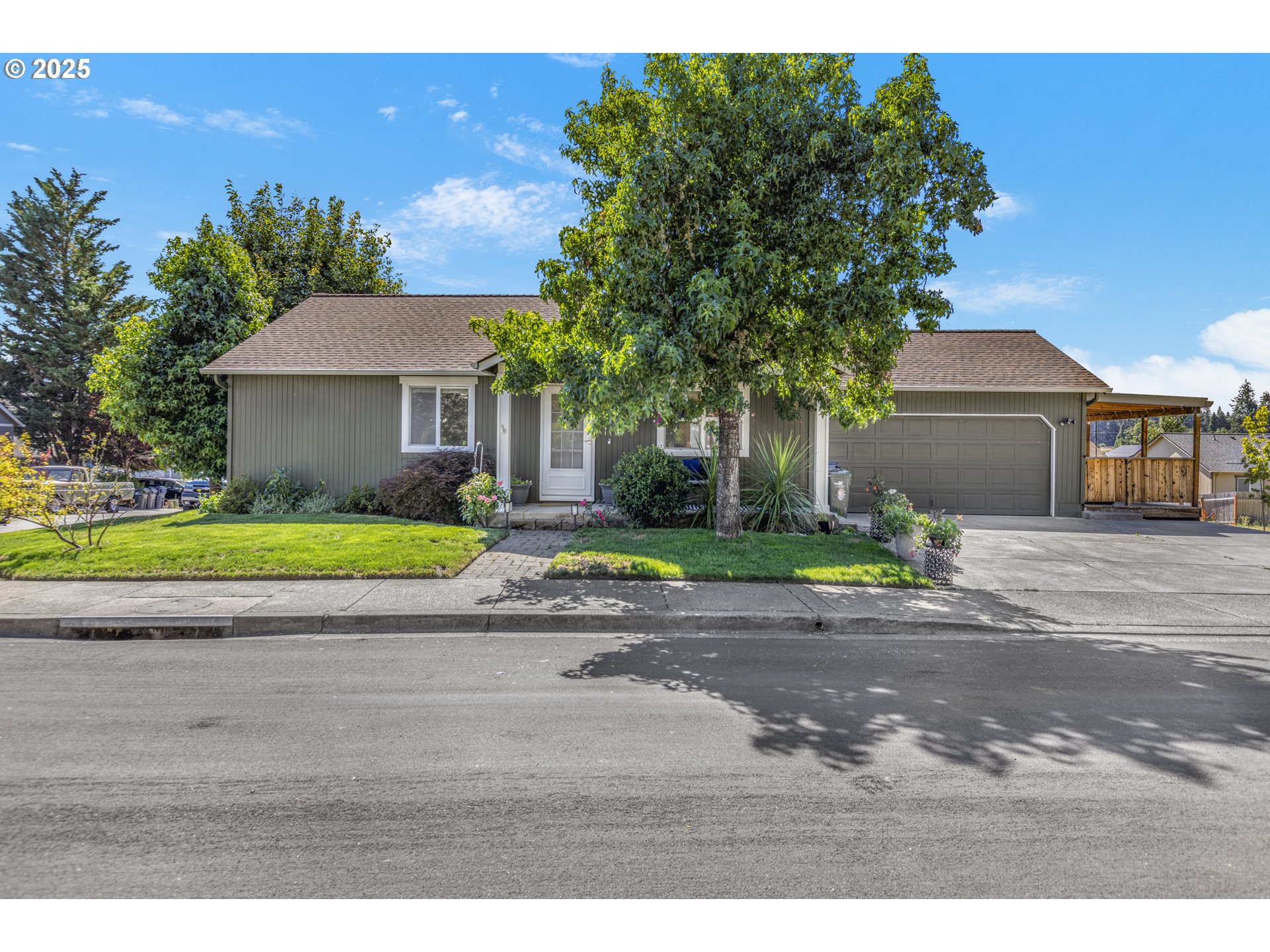 1580 South 60th Street Springfield, OR 97478 - Photo 1 of 36 a view of a house with a yard and potted plants