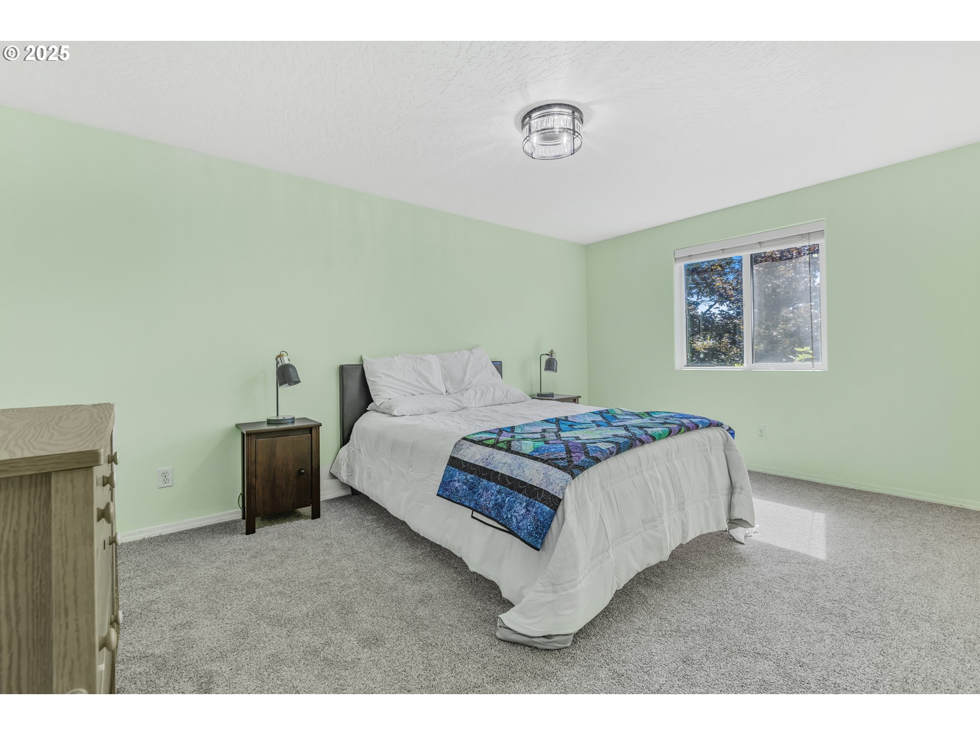 1580 South 60th Street Springfield, OR 97478 - Photo 24 of 36 a bedroom with a bed and a couch