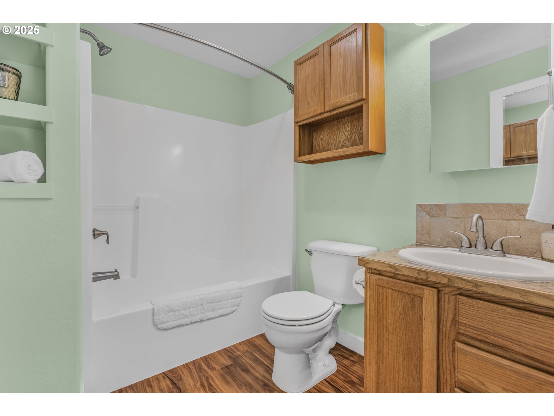 1580 South 60th Street Springfield, OR 97478 - Photo 27 of 36 a bathroom with a granite countertop toilet sink and mirror