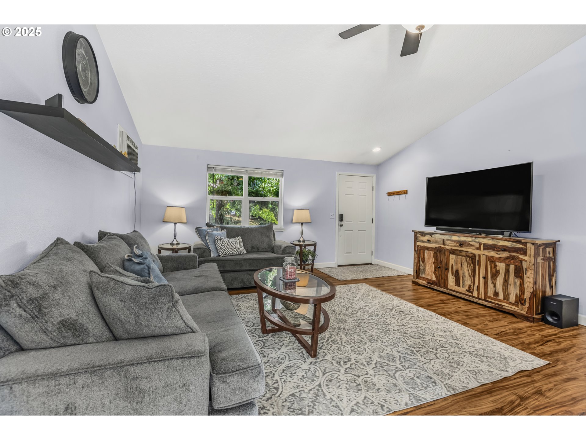 1580 South 60th Street Springfield, OR 97478 - Photo 7 of 36 a living room with furniture and a flat screen tv
