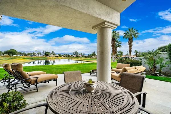 a view of a big yard with a swimming pool and green space