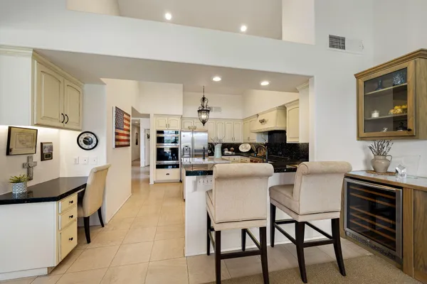 a kitchen with stainless steel appliances granite countertop a sink counter space cabinets and stainless steel appliances