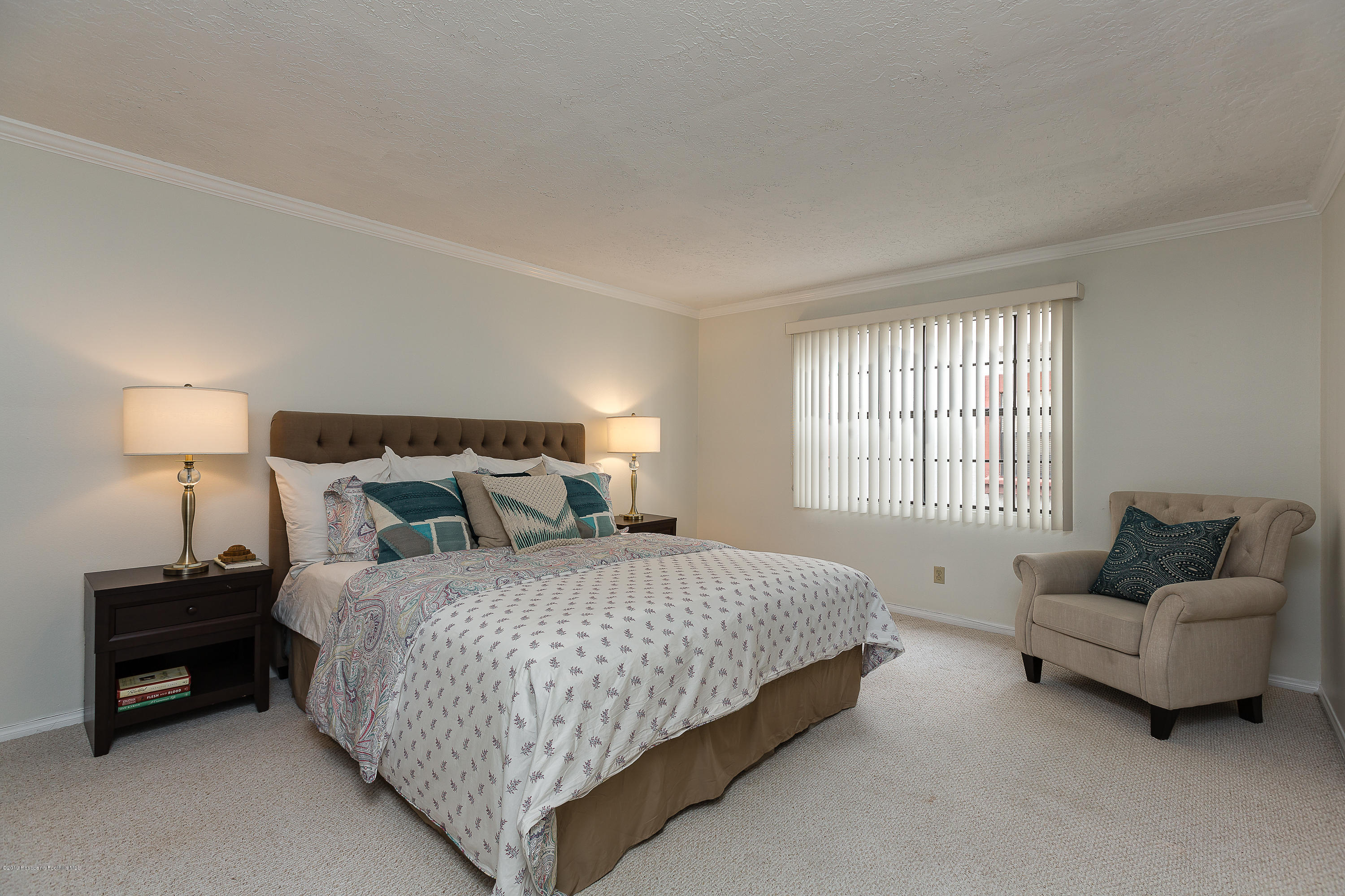 124 Monterey Road, Unit 218 South Pasadena, CA 91030 - Photo 11 of 20 a bedroom with a bed and a couch