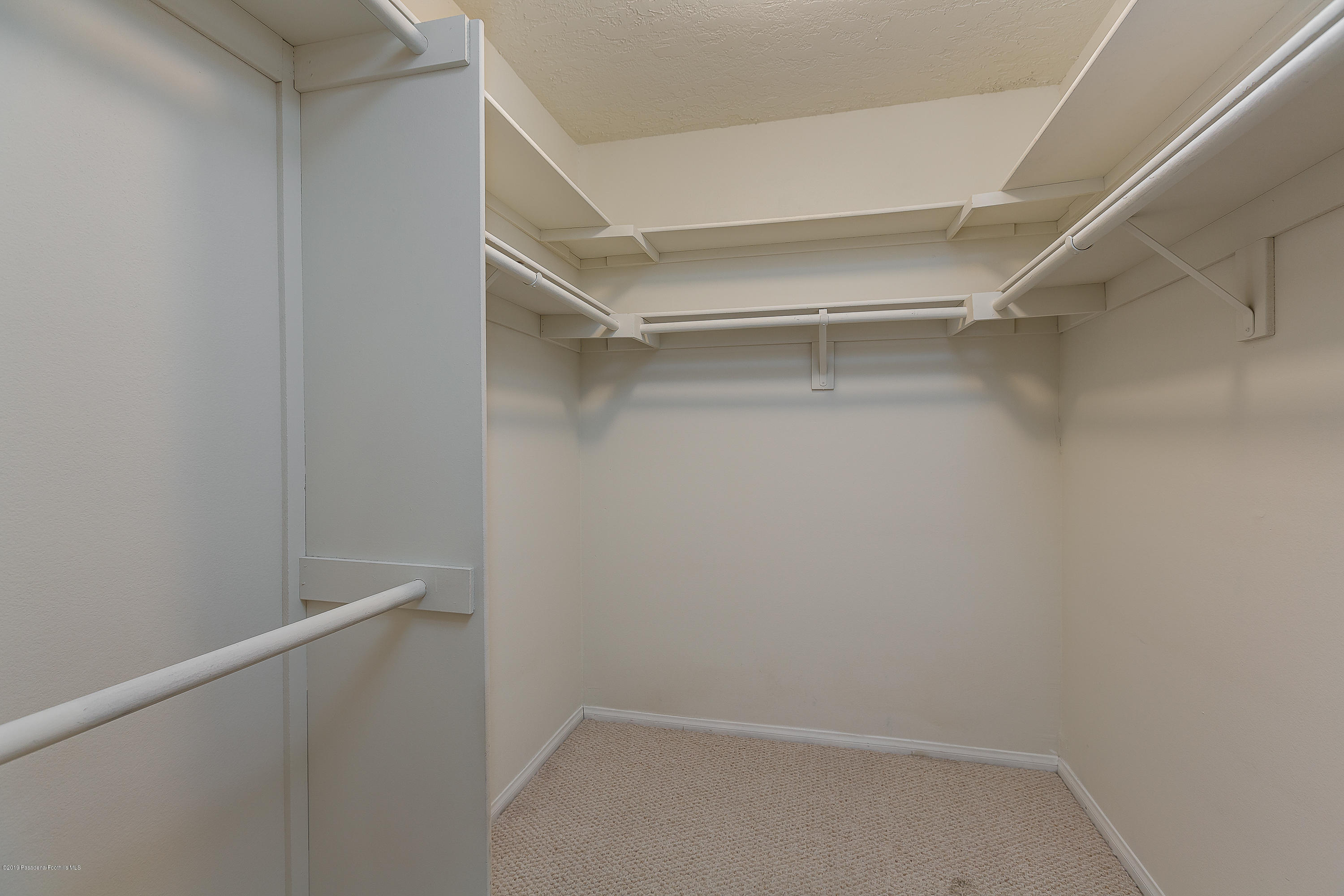 124 Monterey Road, Unit 218 South Pasadena, CA 91030 - Photo 14 of 20 a view of an empty walk in closet