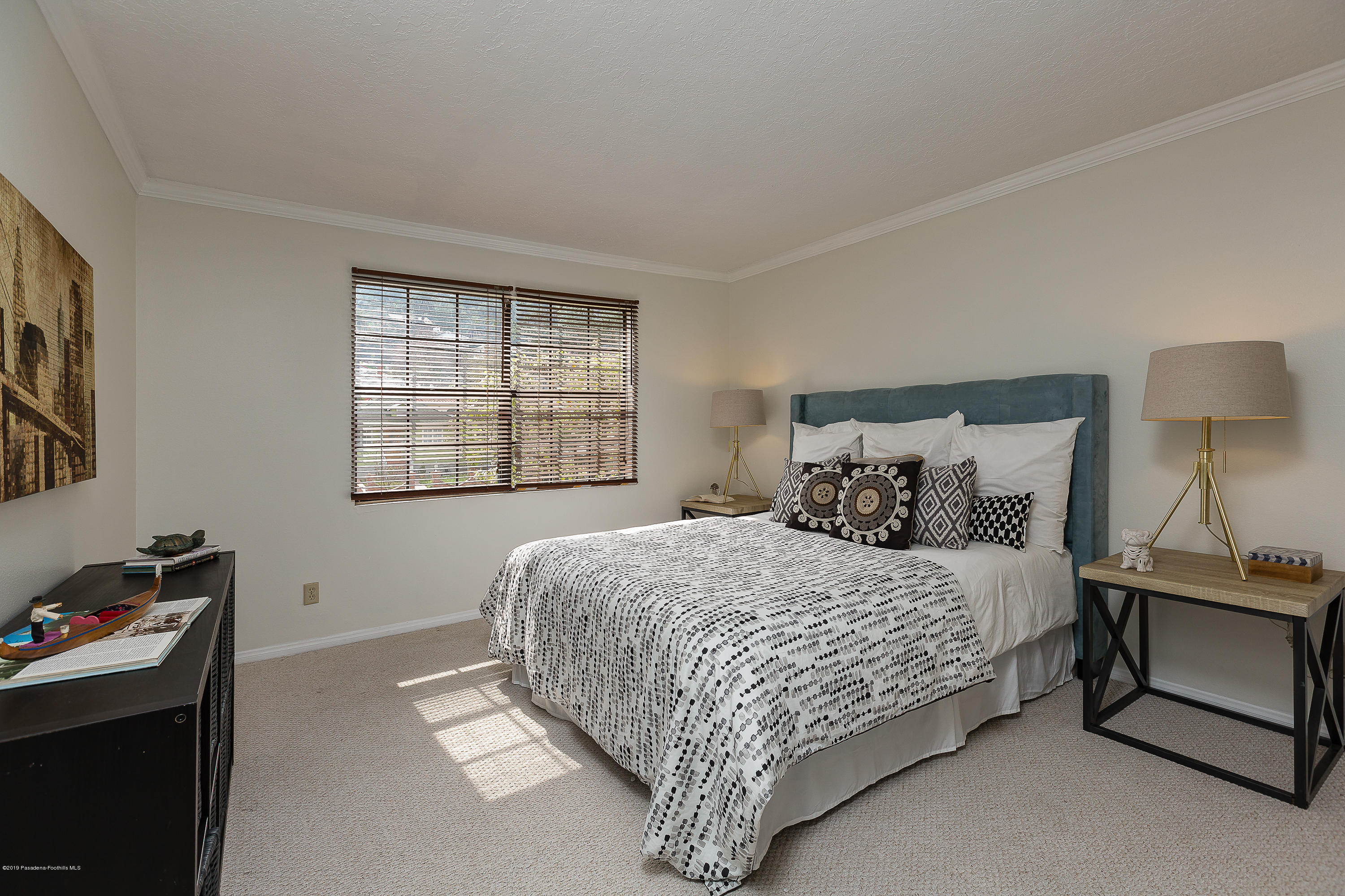 124 Monterey Road, Unit 218 South Pasadena, CA 91030 - Photo 15 of 20 a bedroom with a bed and a window