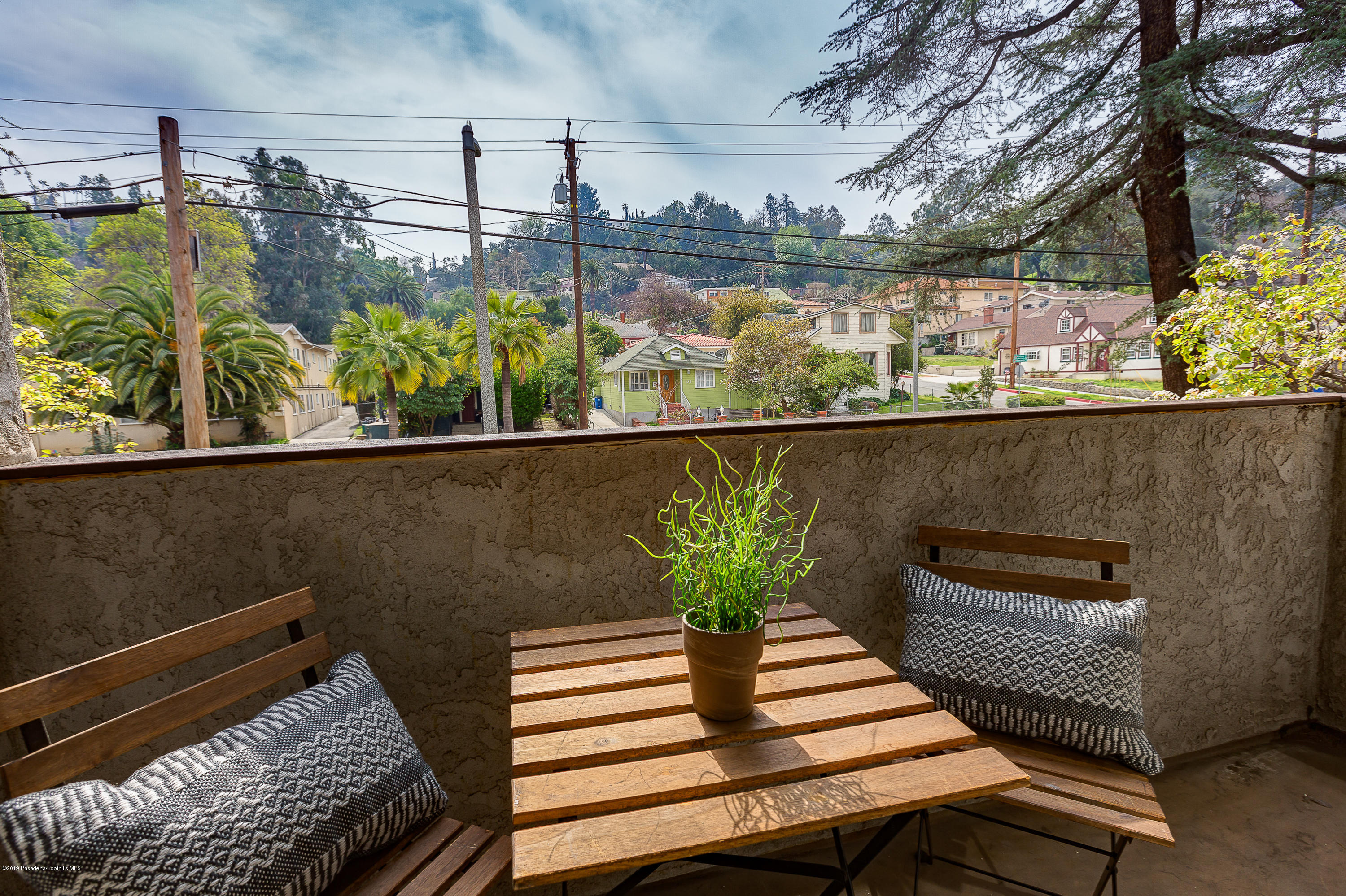 124 Monterey Road, Unit 218 South Pasadena, CA 91030 - Photo 18 of 20 a view of a balcony with chairs