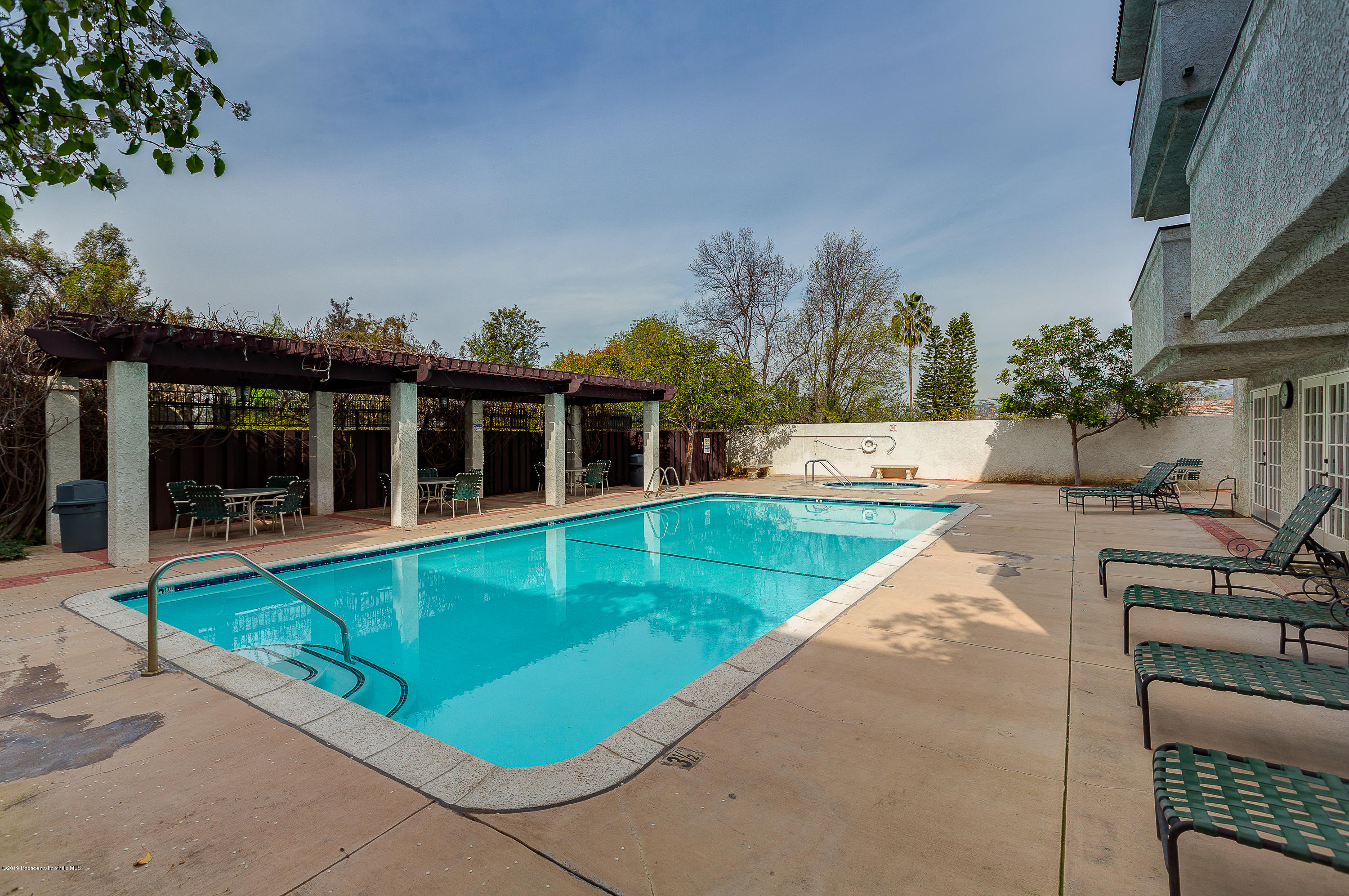 124 Monterey Road, Unit 218 South Pasadena, CA 91030 - Photo 19 of 20 swimming pool with outdoor seating and yard