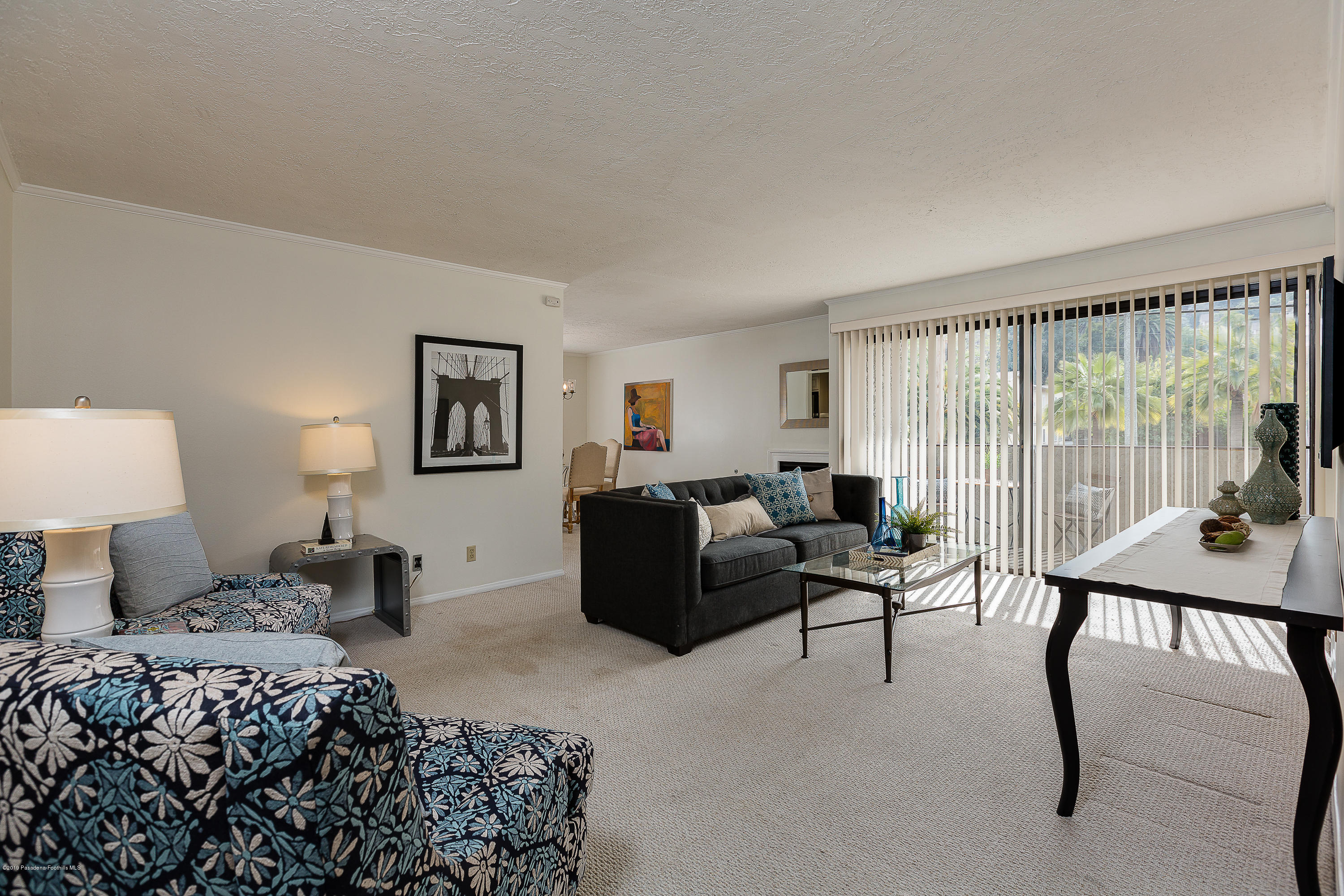 124 Monterey Road, Unit 218 South Pasadena, CA 91030 - Photo 5 of 20 a bedroom with a bed and a large window