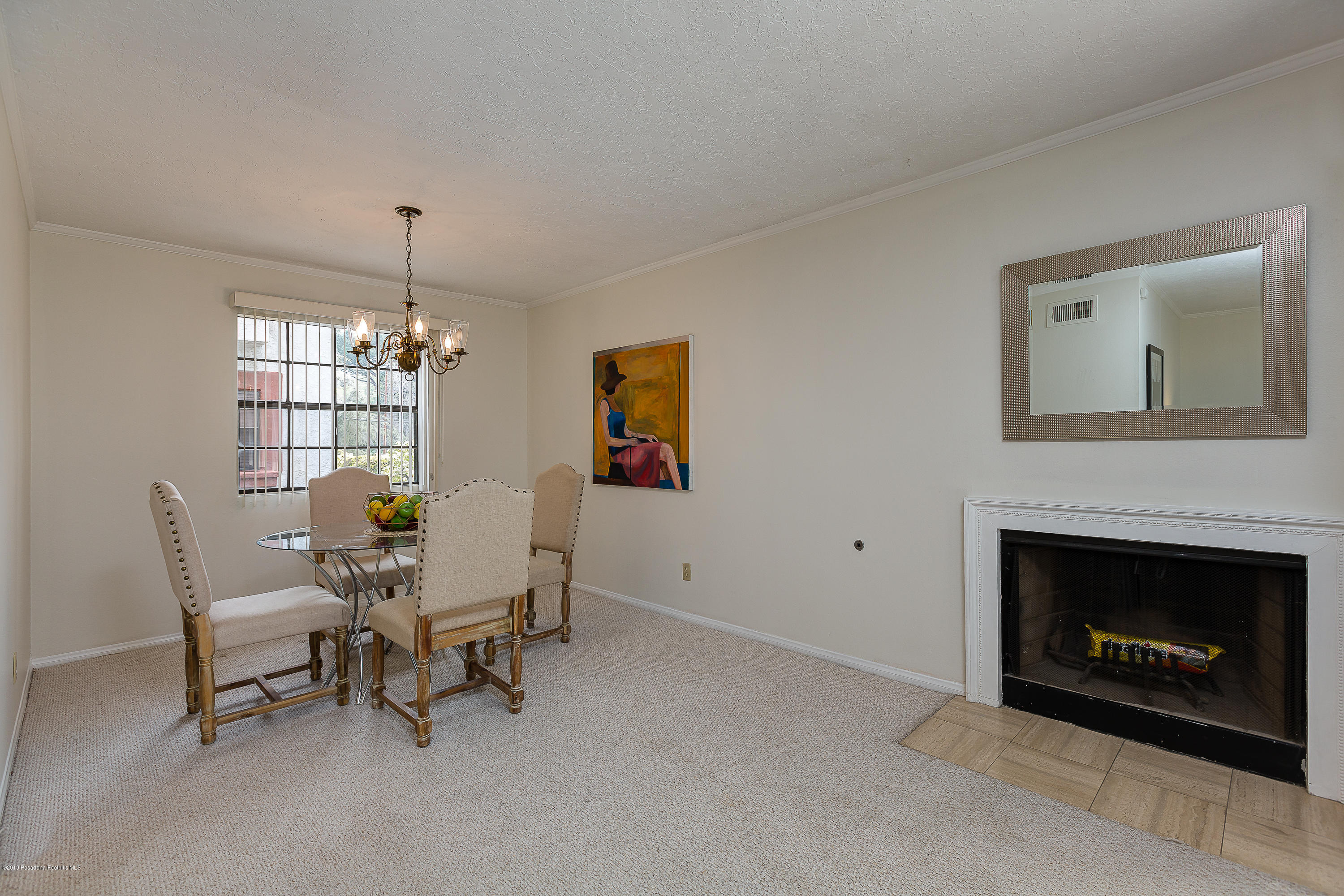 124 Monterey Road, Unit 218 South Pasadena, CA 91030 - Photo 9 of 20 a living room with furniture and a fireplace