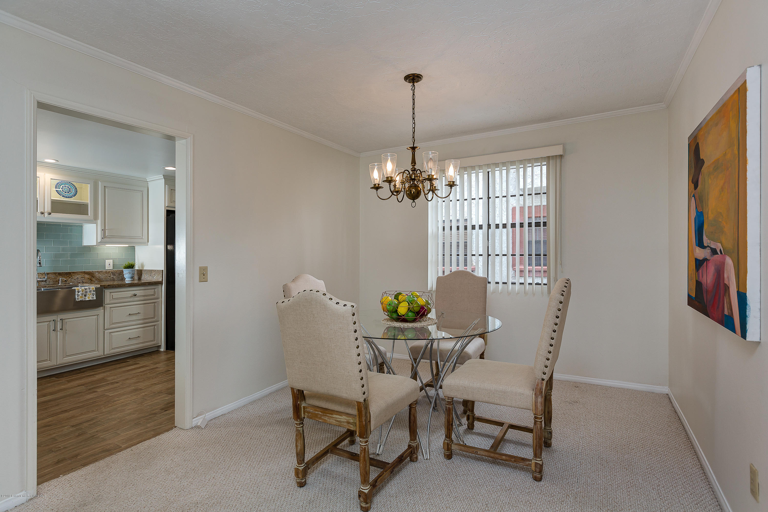 124 Monterey Road, Unit 218 South Pasadena, CA 91030 - Photo 10 of 20 a view of a dining room with furniture and window