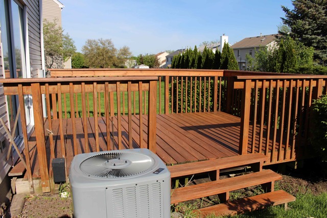 461 Minnesota Circle Carol Stream, IL 60188 - Photo 4 of 15 a balcony with wooden floor table and chairs