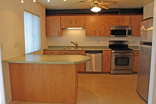 461 Minnesota Circle Carol Stream, IL 60188 - Photo 7 of 15 a kitchen with stainless steel appliances granite countertop a stove a sink and a microwave